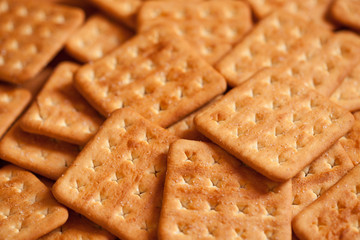 Square salty crackers in natural light. Top view