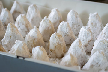 Amygdalota, traditional Greek homemade powder sugared almond cookies, selective focus
