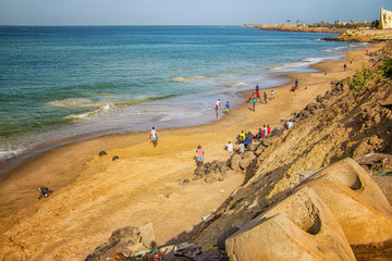 Fototapeta na wymiar Dakar, Senegal- April 24 2019: Men playing football on the beach near Dakar city in Africa. It is the capital city of Senegal.