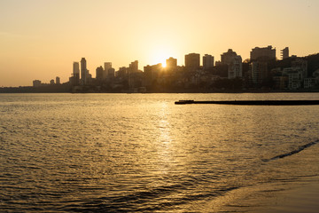 Sunset on Chowpatty beach in Mumbai. India