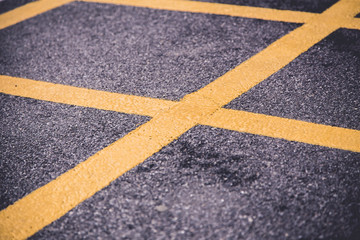 yellow cross on the pavement