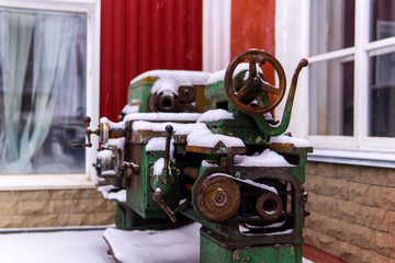 decommissioned obsolete equipment stands in the snow outside
