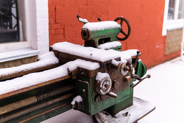 decommissioned obsolete equipment stands in the snow outside