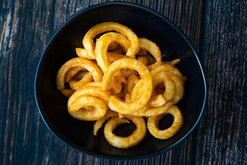 Spicy Seasoned Curly Fries Ready to Eat with Sauce.