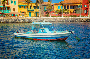 View to boat near small historic town at the island in Africa. It is small island near Dakar. It was was the largest slave trade center on the African coast.