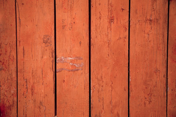 Peeling paint on a wooden board, background texture