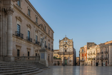 Fototapeta na wymiar Main square and view of the church in the center of Ortigia island in province of Syracuse in Sicily, south Italy