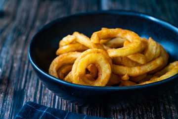 Spicy Seasoned Curly Fries Ready to Eat with Sauce.
