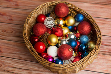 Backgrounds and textures. Christmas balls with cones and snowflakes in a wicker basket