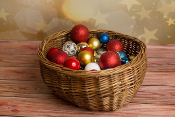 Backgrounds and textures. Christmas balls with cones and snowflakes in a wicker basket
