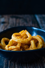 Spicy Seasoned Curly Fries Ready to Eat with Sauce.