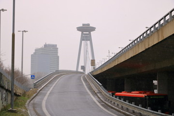 View on the Modern bridge with observation deck and restaurant called UFO in Bratislava city in...