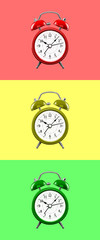 Three colored alarm clocks on a background of colored squares of the opposite color.