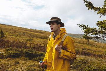 pensive thoughtful hiker looking at the horizon. close up photo, relaxation