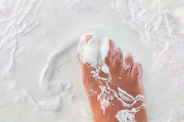 barefoot walk on muddied limestone