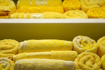 yellow Terry towels. sale snuggly, yellow, textures bath towels on a shelf