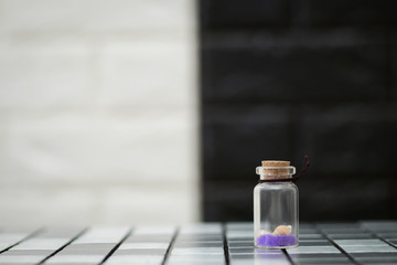 Small shells in a small glass bottle
