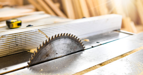 Obraz na płótnie Canvas Saws details of wood cutter machine with a circular saw. Circular cutting saw for wood process.