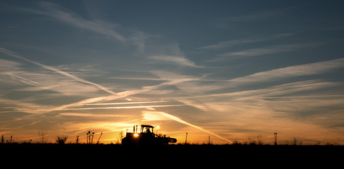 sunset and tractor