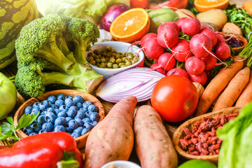 A variety of fresh fruits, vegetables top view. Large vegetable and citrus mix collection.