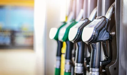 Foto op Aluminium Colorfull fuel gasoline dispenser background. Fuel pumps station close up, copy space. © Milan