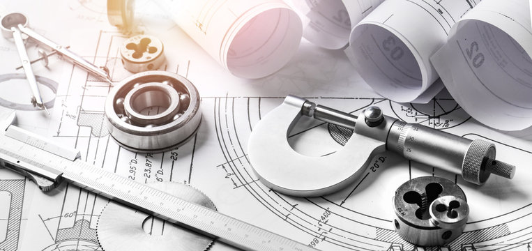 Technical drawings with measure tools. Pencil, measurement. Papers with technical drawings and diagrams on the table...C