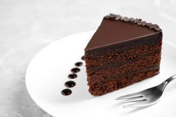 Piece of tasty chocolate cake served on plate