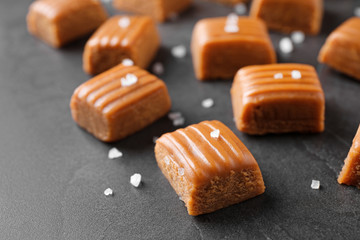 Salted caramel on grey table, closeup view
