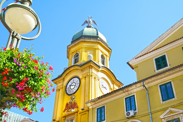 Rijeka Square clock with summer Flower Baskets on lamp post.  Kvarner, Croatia