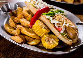 Hotdogs and French fries on a dishes. Fast food meal. Restaurant.