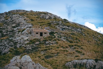 Small brick mountain refuge in the middle of the mountain