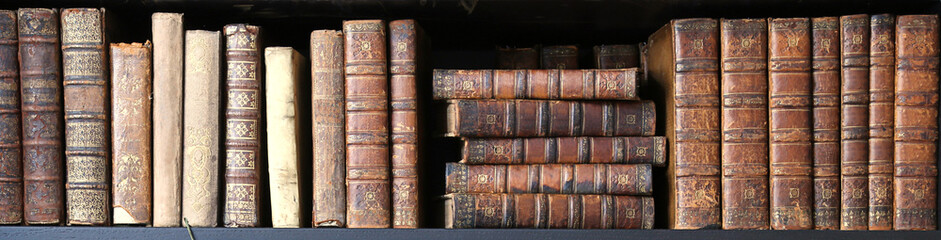 old books on wooden shelf