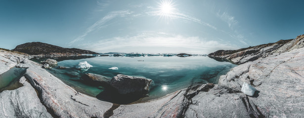Beautifull landscape with floating icebergs in glacier lagoon and lake in Greenland. Ilulissat...