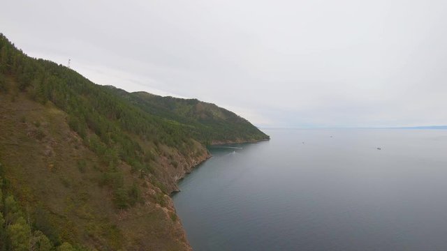 Aerial view of rocky coast. Flying to right