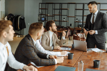 people hold conference at office. Business executive delivering presentation to colleagues or business partners during meeting or in-house business training, explaining business plans