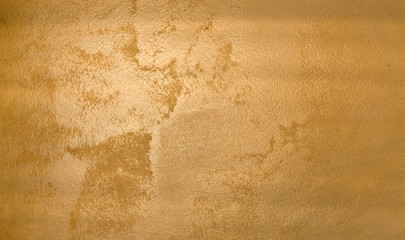 Shiny yellow leaf gold foil texture background