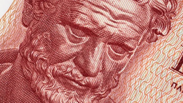 Democritus on 100 Greece drachma (1967) banknote rotated. Genius ancient Greek philosopher. Author of atomic theory of the universe. 4K