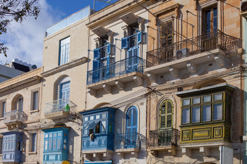 colorful windows in an old house in Valetta, Malta - 314744211