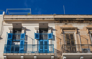 colorful windows i an old house in Valetta, Malta - 314744259