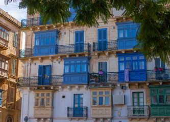colorful windows in an old house in Valetta, Malta - 314745234