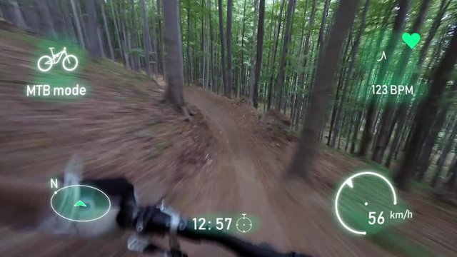 POV of the mountain biker with augmented reality interactive interface display riding in the forest