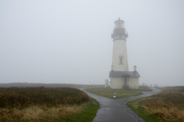 Fototapeta na wymiar The Yaquina Head lighthouse shrouded in mist
