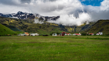 Fototapeta na wymiar Iceland - Small Village Beneath the Mountains