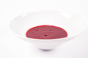 Beetroot cream soup on a white background