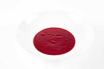 Beetroot cream soup on a white background