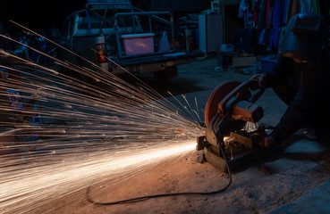 Cutting metal with cutting machine.