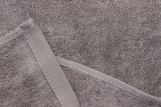 background texture of a gray clean towel. top view. Copy space