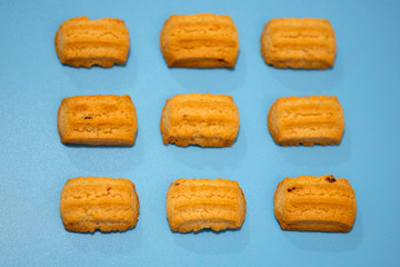 Selective focus. Shortbread cookies on a blue background top view.