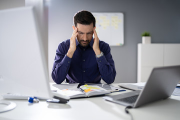 Businessman Suffering From Headache