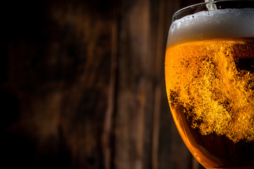 Glass of beer on wooden